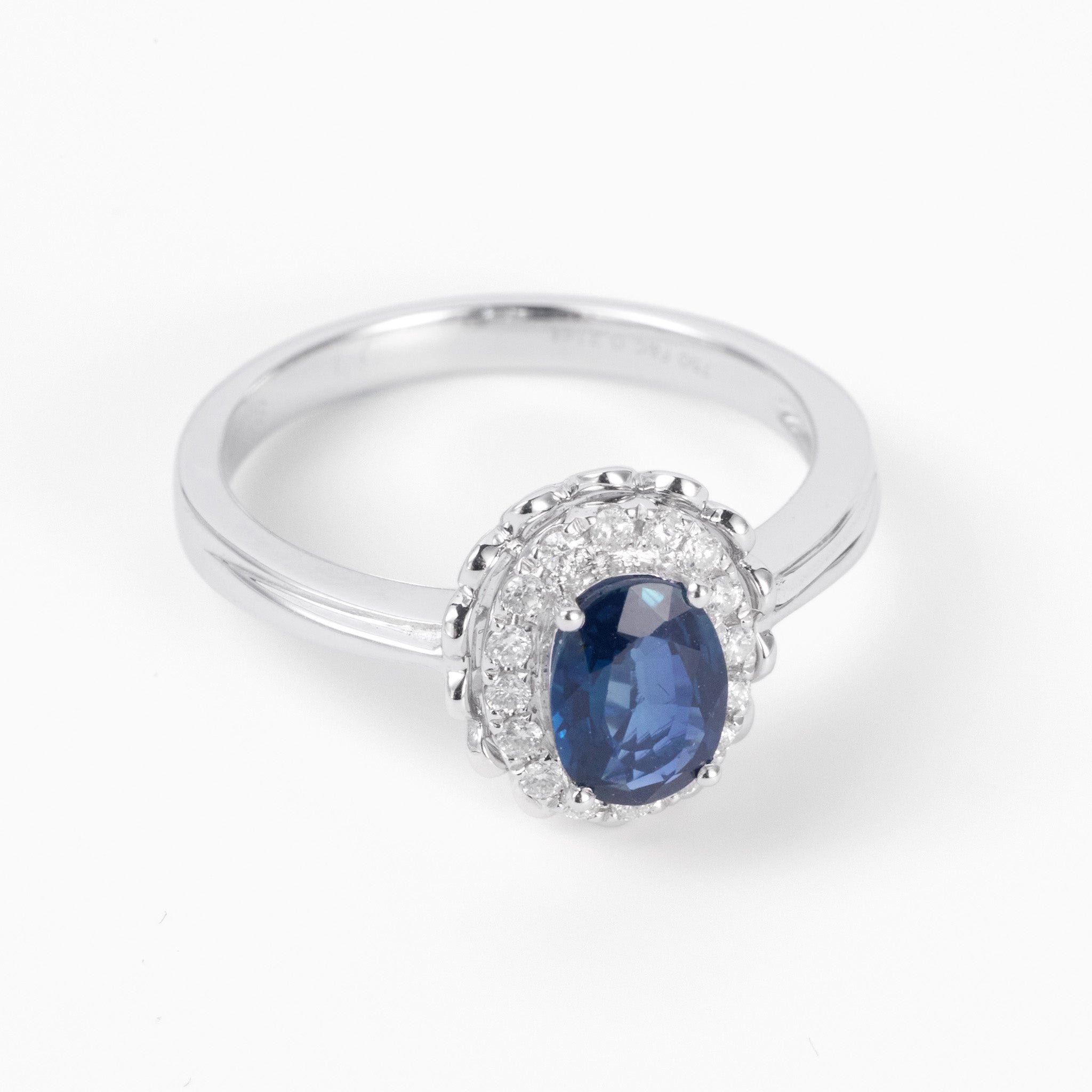 0.79ct. Elegant Oval Natural Blue Sapphire Diamond Halo Ring in 18K White Gold - JewelryAndStore