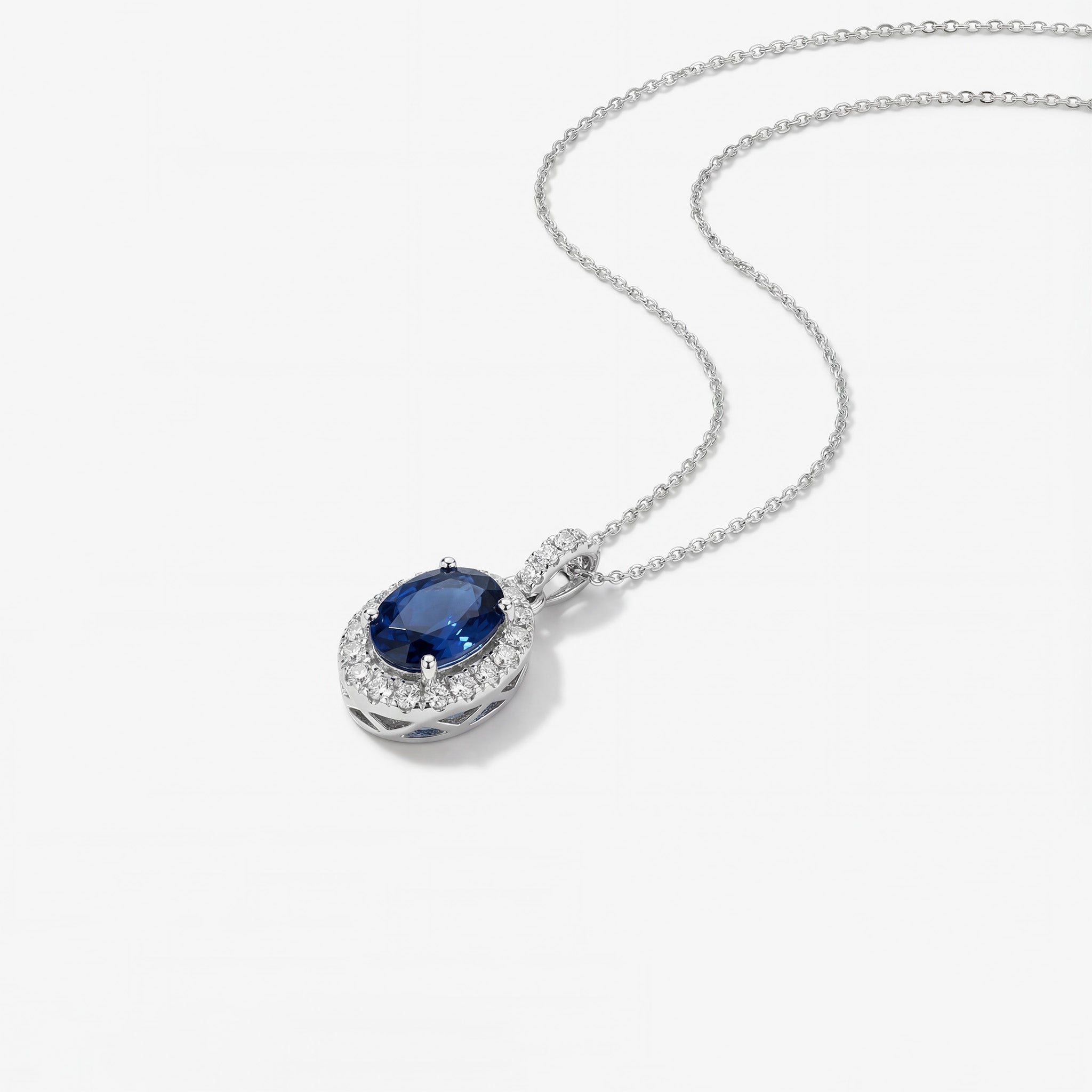 0.61ct Natural Blue Sapphire and Diamond Halo Pendant in 18K White Gold - JewelryAndStore