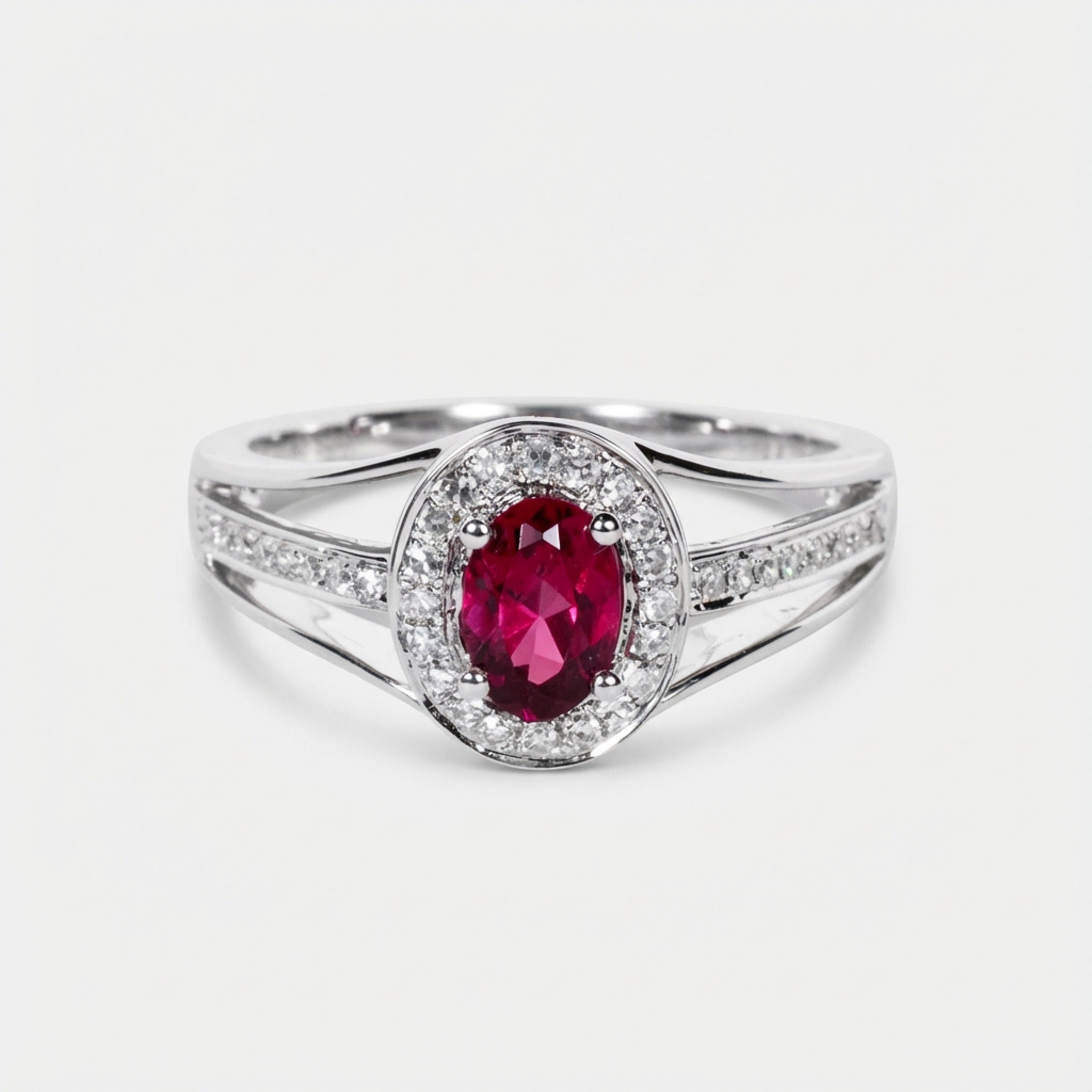 0.52ct Oval Ruby and Diamond Halo Ring in 14K White Gold - JewelryAndStore