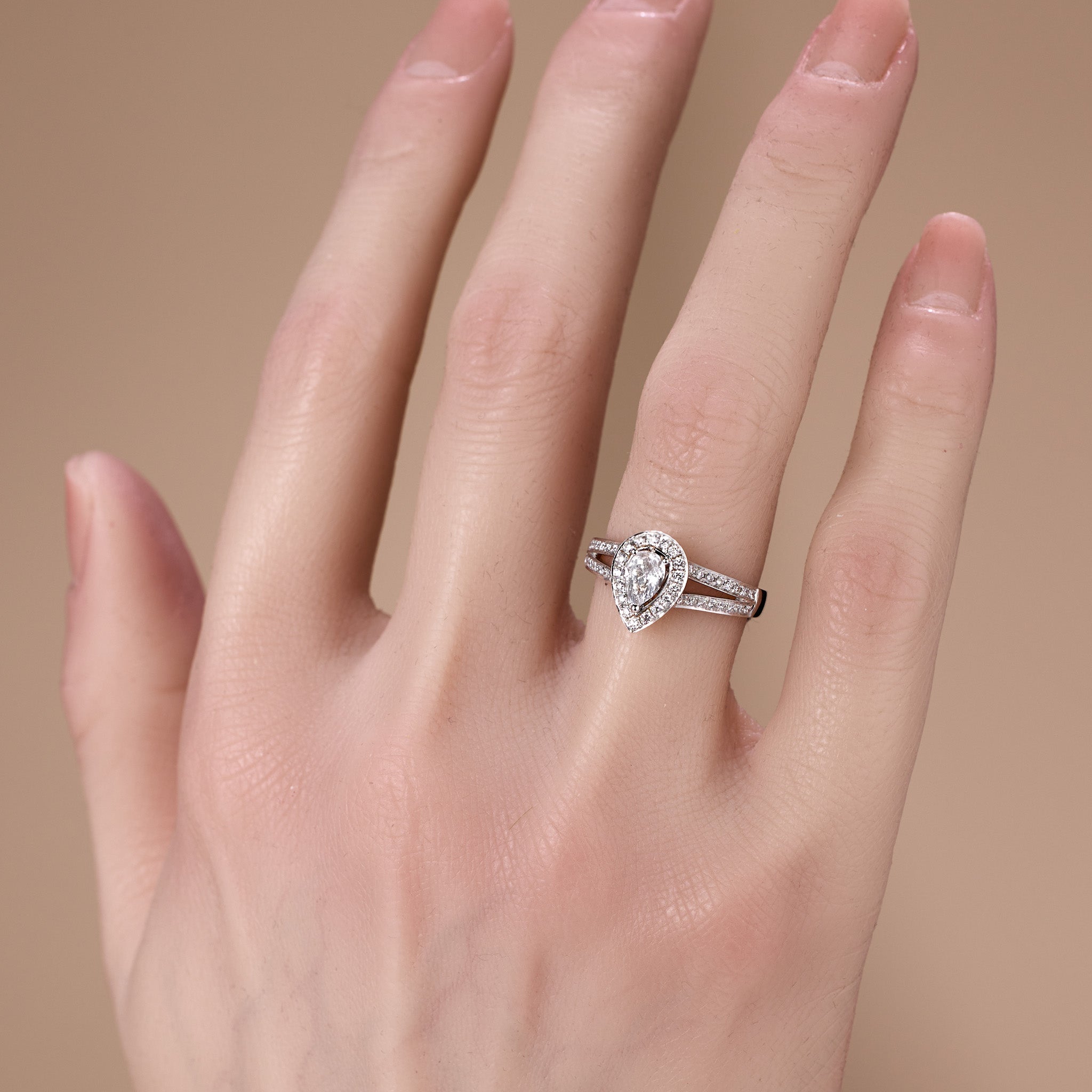 0.69ct.tw. Pear - Shaped Diamond Halo Engagement Ring in 18K White Gold - JewelryAndStore