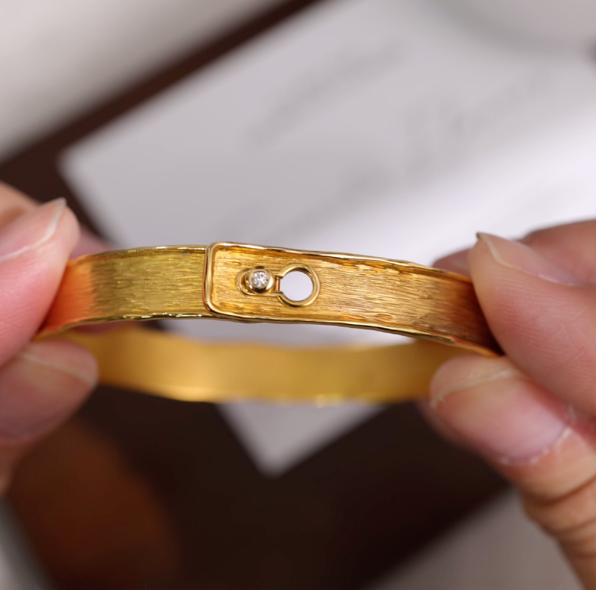 18K gold "easy click" diamond bangle with hand-hammered texture from JewelryandStore