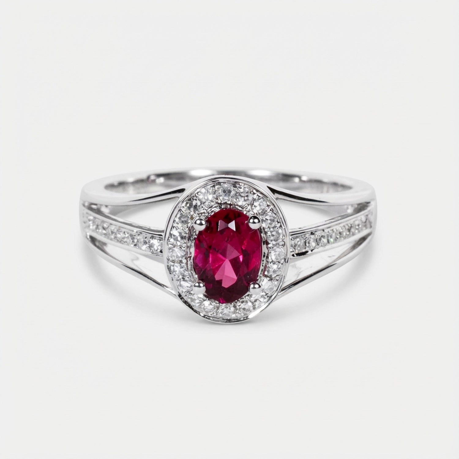 0.52ct Oval Ruby and Diamond Halo Ring in 14K White Gold - JewelryAndStore