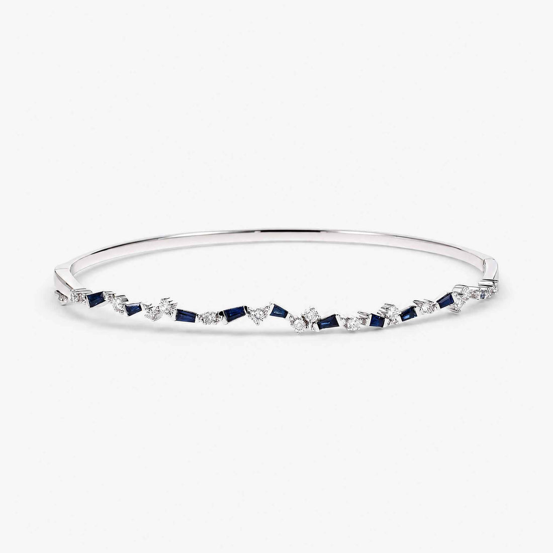 Natural Blue Sapphire and Diamond Asymmetric Wave Cluster Bangle in 18K White Gold - JewelryandStore