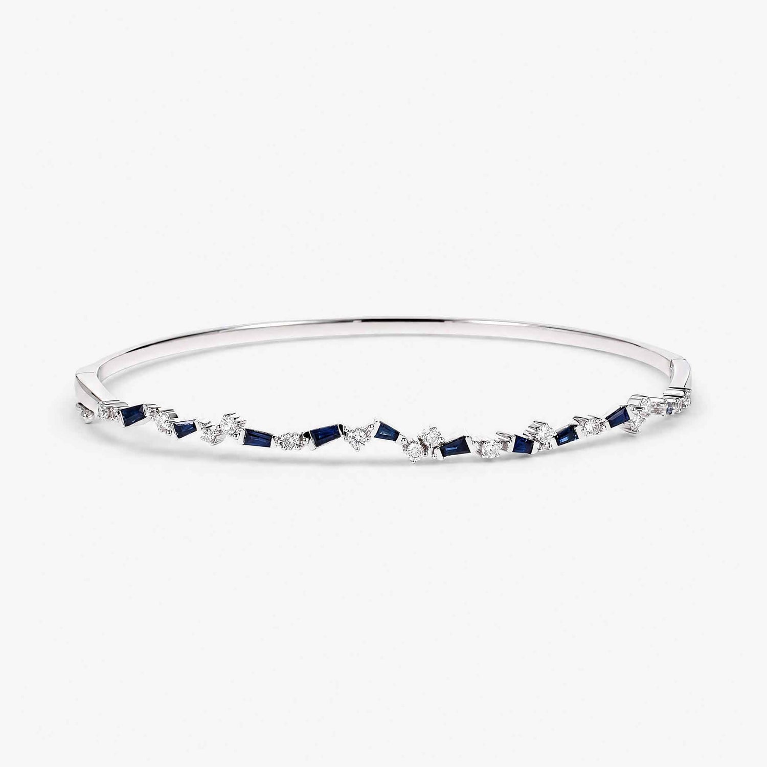 Natural Blue Sapphire and Diamond Asymmetric Wave Cluster Bangle in 18K White Gold - JewelryandStore