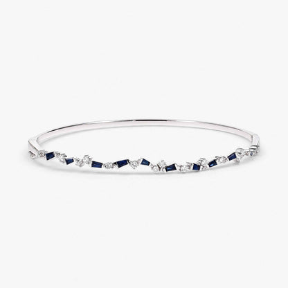 Natural Blue Sapphire and Diamond Asymmetric Wave Cluster Bangle in 18K White Gold - JewelryandStore