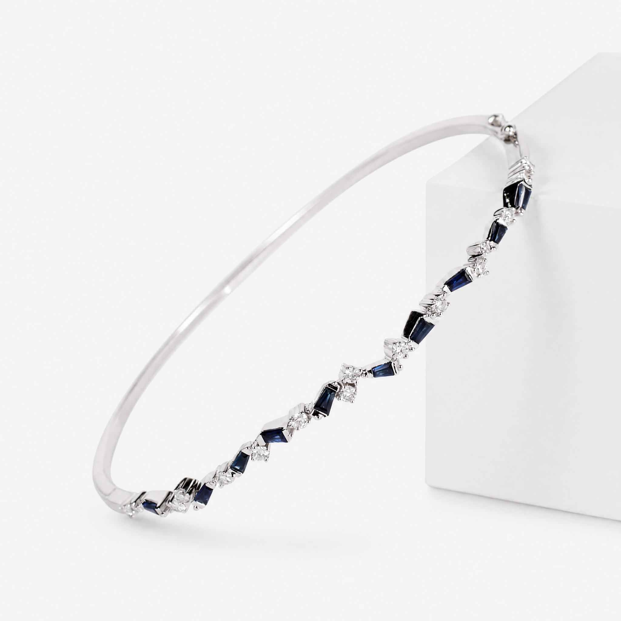 Natural Blue Sapphire and Diamond Asymmetric Wave Cluster Bangle in 18K White Gold - JewelryandStore