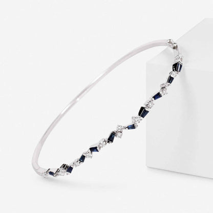 Natural Blue Sapphire and Diamond Asymmetric Wave Cluster Bangle in 18K White Gold - JewelryandStore