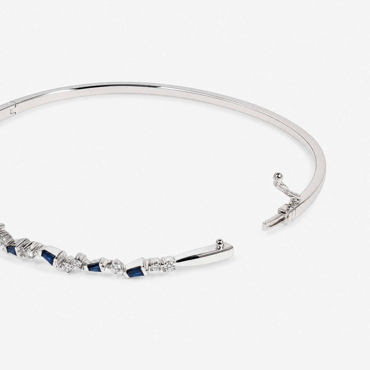 Natural Blue Sapphire and Diamond Asymmetric Wave Cluster Bangle in 18K White Gold - JewelryandStore