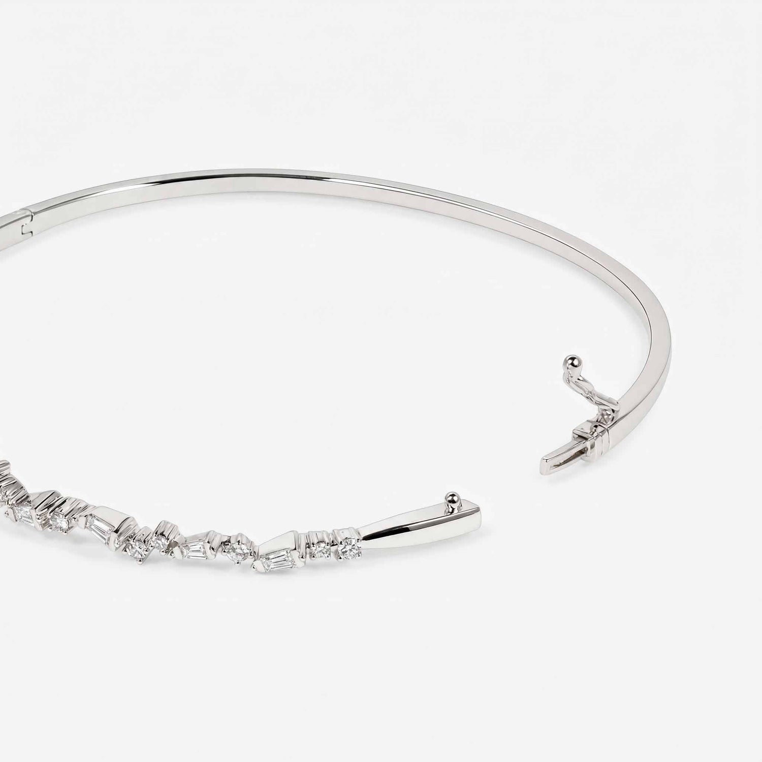 Natural Baguette and Round Diamond Asymmetric Wave Cluster Bangle in 18K White Gold - JewelryAndStore