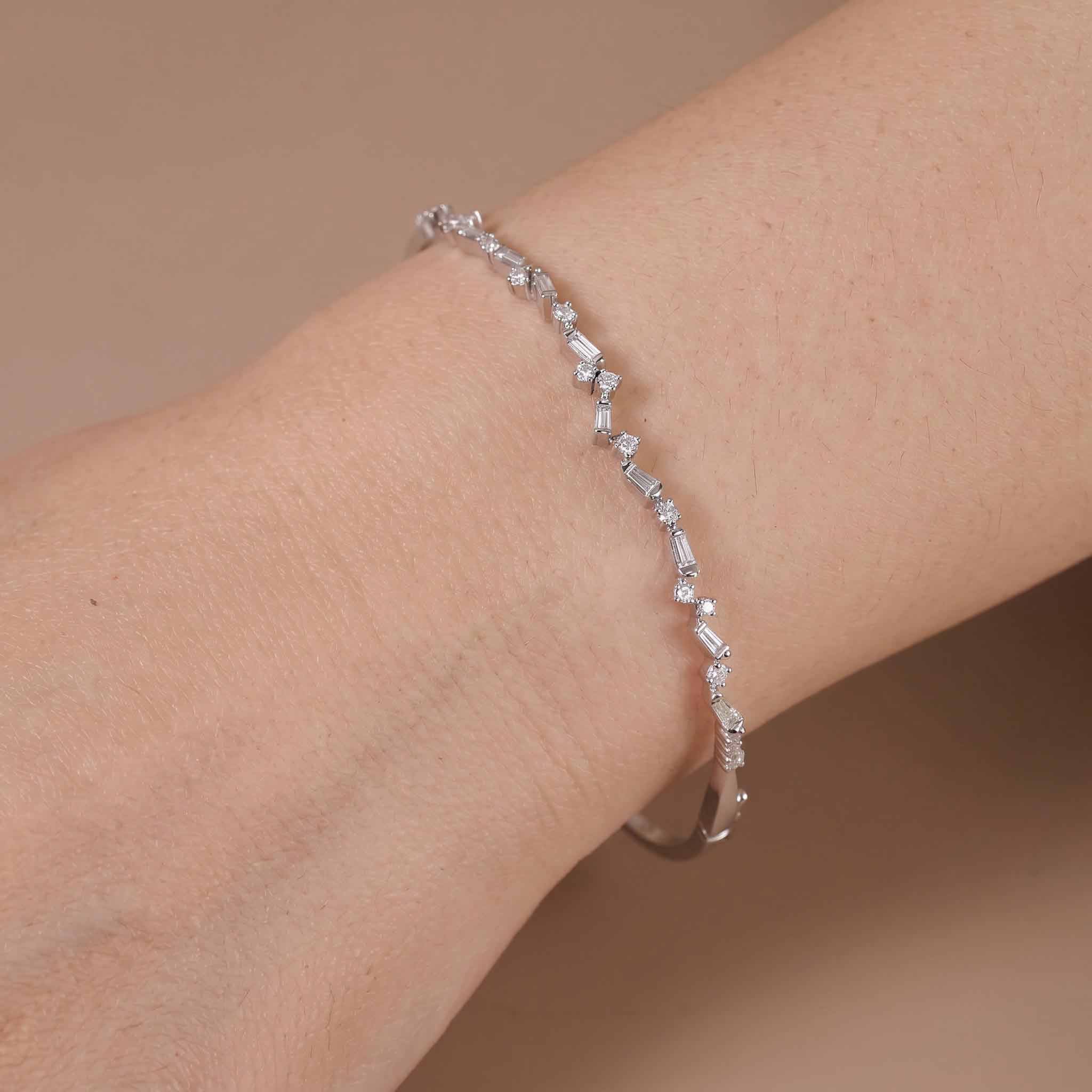 Natural Baguette and Round Diamond Asymmetric Wave Cluster Bangle in 18K White Gold - JewelryAndStore