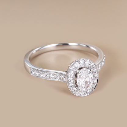 0.69ct.tw. Oval Diamond Halo Engagement Ring in 18K White Gold