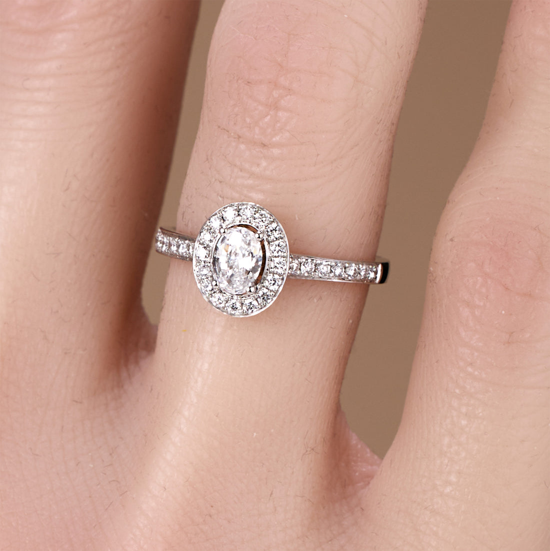0.69ct.tw. Oval Diamond Halo Engagement Ring in 18K White Gold - JewelryAndStore
