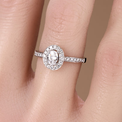 0.69ct.tw. Oval Diamond Halo Engagement Ring in 18K White Gold - JewelryAndStore
