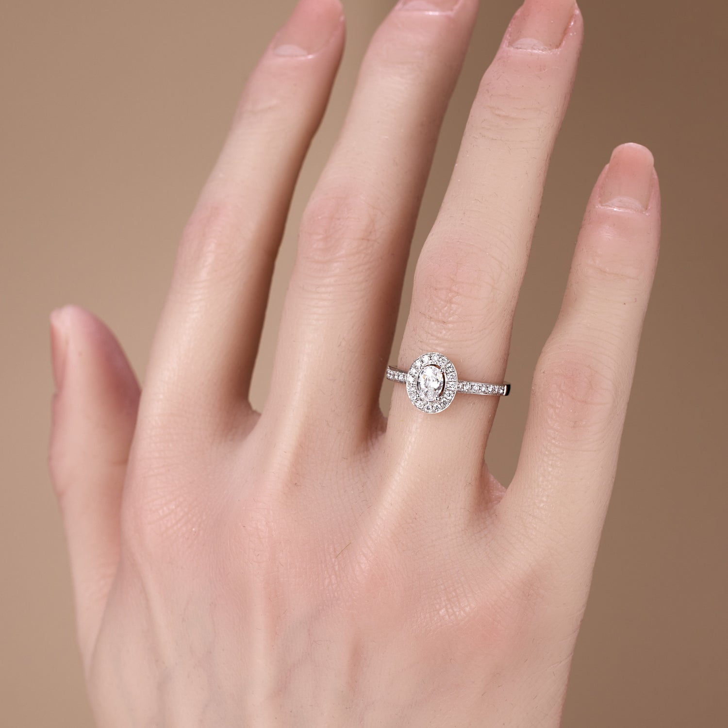 0.69ct.tw. Oval Diamond Halo Engagement Ring in 18K White Gold