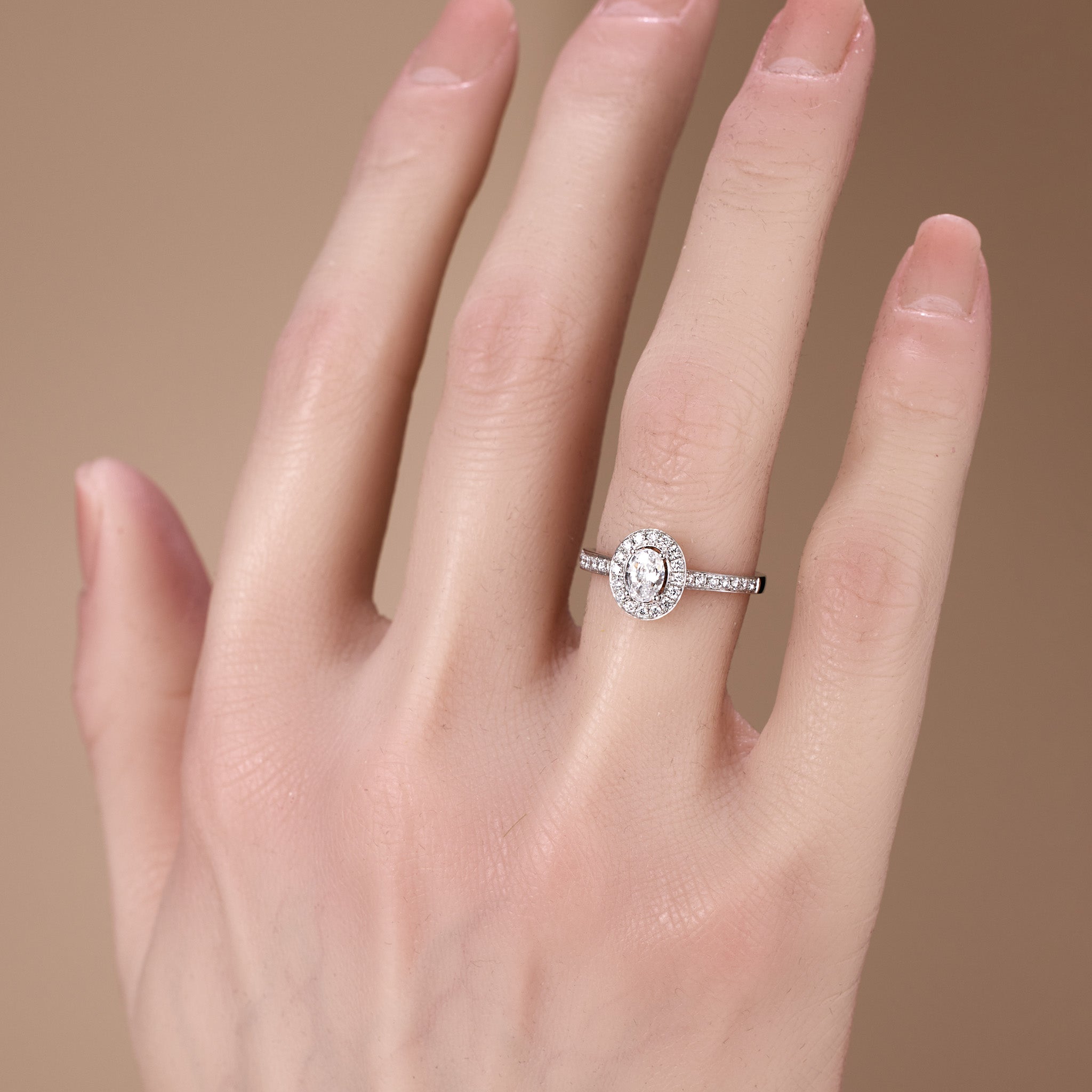 0.69ct.tw. Oval Diamond Halo Engagement Ring in 18K White Gold