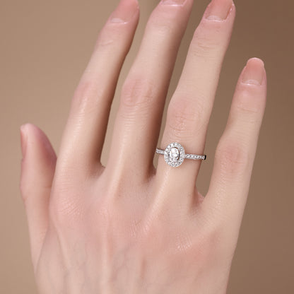 0.69ct.tw. Oval Diamond Halo Engagement Ring in 18K White Gold