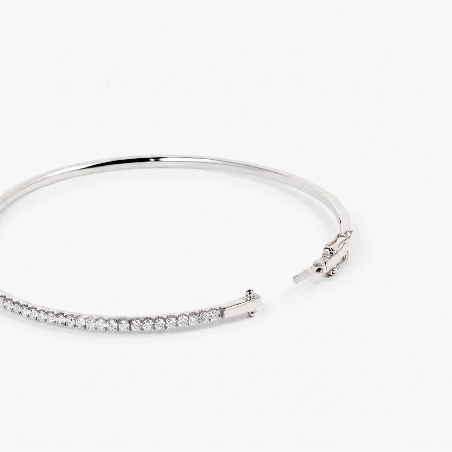 Minimalist Single Row Diamond Tennis Bangle in 18K White Gold - JewelryAndStore