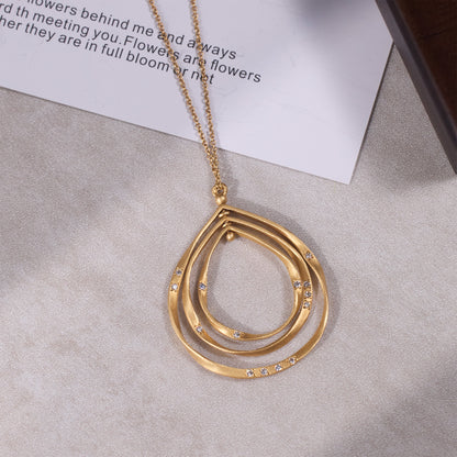 14K Matte Gold Galaxy - Inspired Rotatable Teardrop Pendant with Natural Diamonds - Jewelry And Store