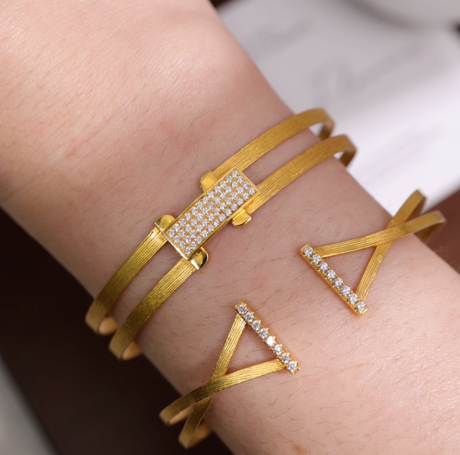 18K gold open-ended diamond bangle with hand-hammered texture from JewelryandStore